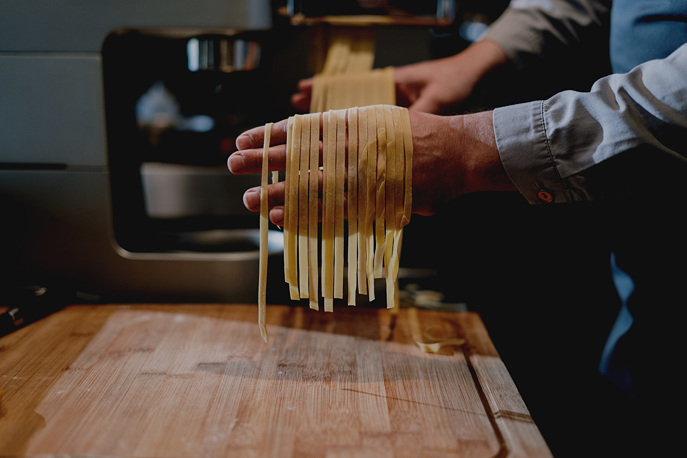 Person Holding Brown Wooden Sticks